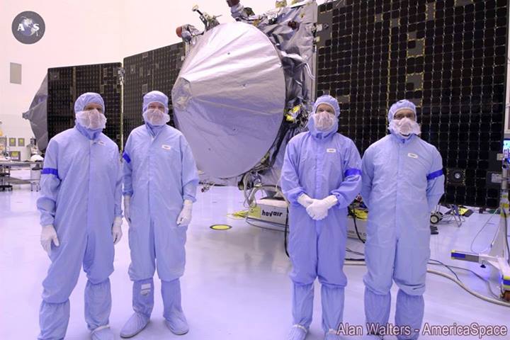 Mission team member pose with their spacecraft.  Photo Credit: Alan Walters