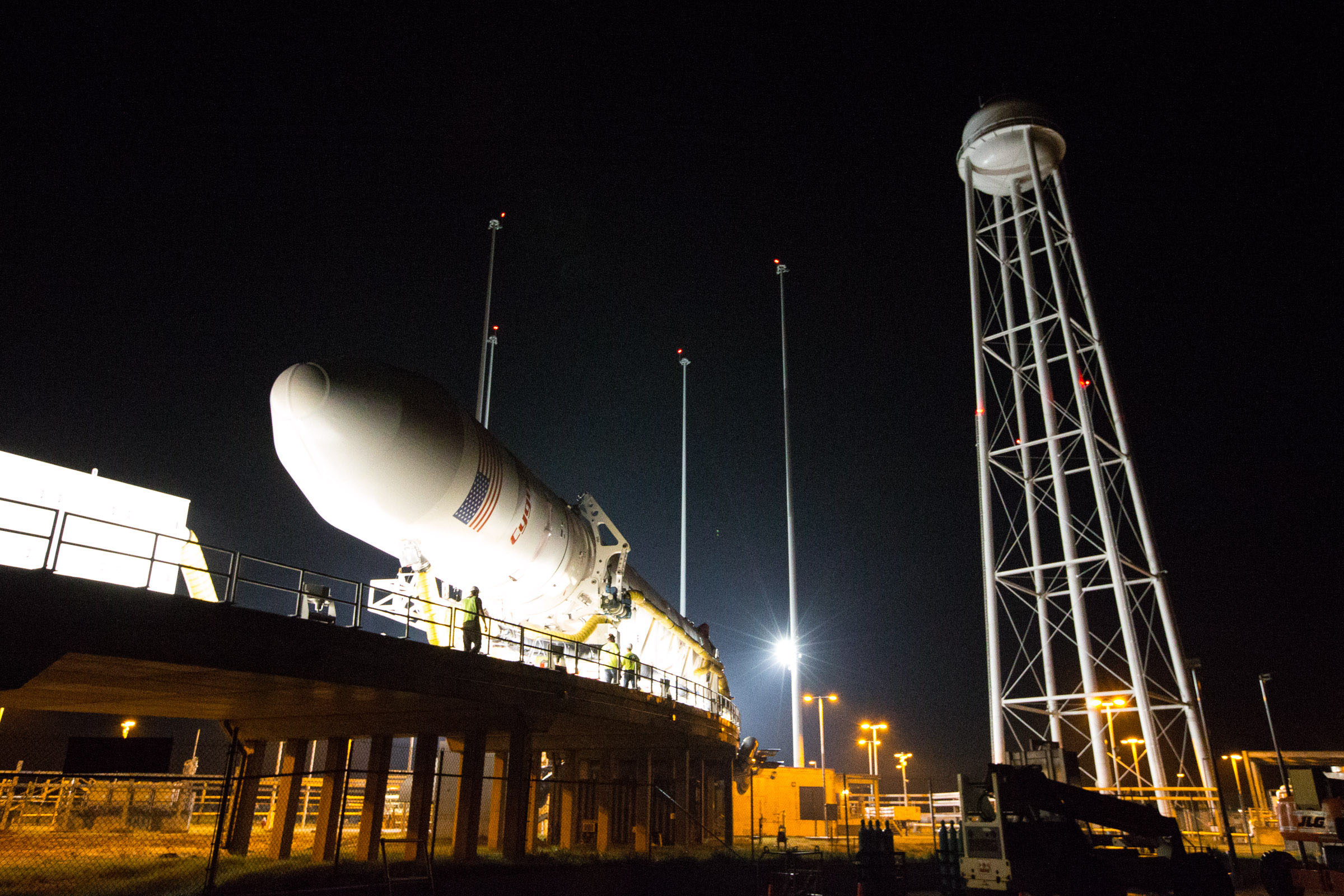 The Antares rocket is rolled out to the launch pad in this NASA image. Rollout occurred yesterday, Sept. 13 at NASA's Wallops Flight Facility in Virginia. Photo Credit: NASA / Orbital