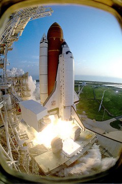 After a month-long wait for launch, following a harrowing pad abort, STS-51 thunders into space on 12 September 1993. Photo Credit: NASA