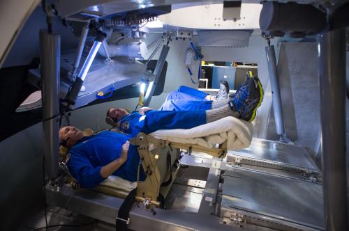Astronauts Rick Linnehan and Mike Foreman try out a prototype display and control system inside an Orion spacecraft mockup at NASA’s Johnson Space Center in Houston during the first ascent and abort simulations for the program. Photo Credit: NASA 