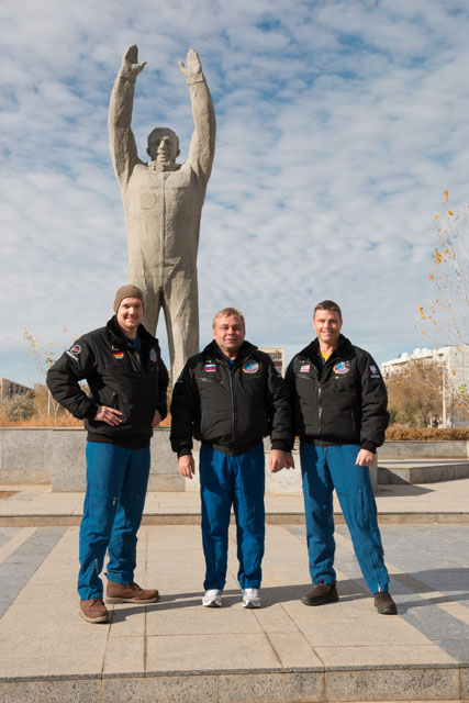 Paying their own tribute before a statue of Yuri Gagarin, the first man in space, Soyuz TMA-11M backup crewmen (from left) Alexander Gerst, Maksim Surayev and Reid Wiseman are scheduled to begin their own mission to the space station in May 2014. Photo Credit: NASA
