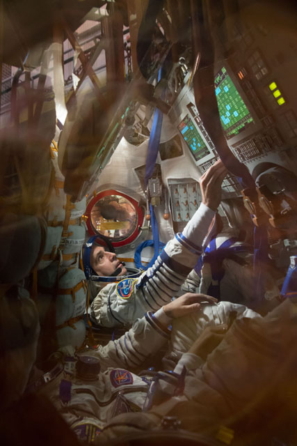 Rick Mastracchio rehearses his activities inside the Soyuz TMA-11M descent module. Photo Credit: NASA