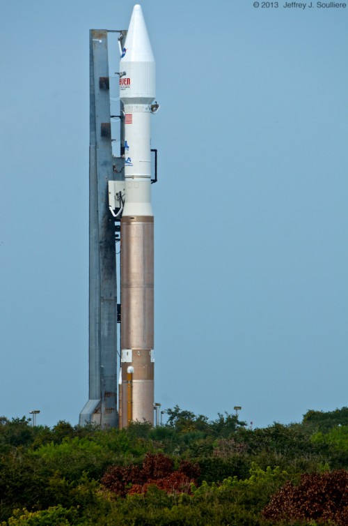 The 188-foot tall Atlas-V 401 rocket rolls out to the launch pad Saturday morning.  Photo Credit: AmericaSpace / Jeffrey Soulliere