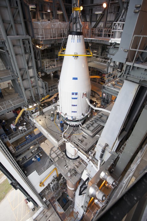 Crews guide NASA's MAVEN spacecraft, inside a payload fairing, into place atop a United Launch Alliance Atlas V rocket at the Vertical Integration Facility at Space Launch Complex 41. Photo Credit: NASA / Kim Shiflett