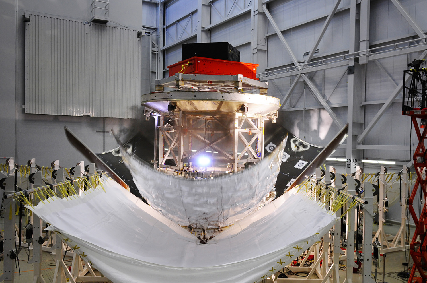 The three panel or fairings encapsulating a stand-in for Orion’s service module successfully detach during a test Nov. 6, 2013 at Lockheed Martin’s facility in Sunnyvale, Calif. Image Credit: Lockheed Martin