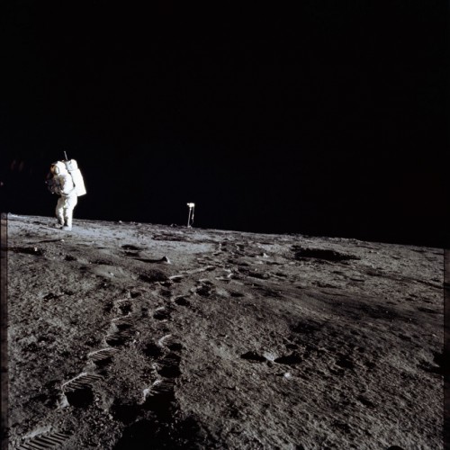 In one of the more unfortunate scenes from Apollo 12, Al Bean walks away from the television camera, which had been inadvertently damaged by exposure to the Sun. Photo Credit: NASA