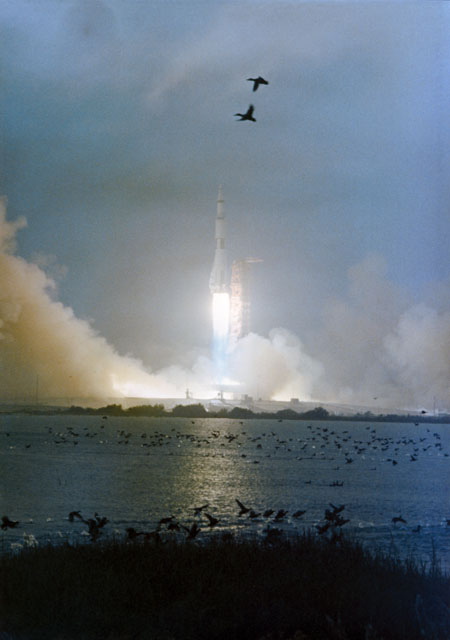 In drizzle and with ominous thunderstorms and lightning in the area, Apollo 12 takes flight on 14 November 1969. Photo Credit: NASA