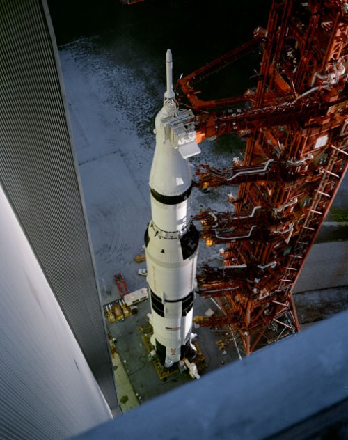 Mounted atop the Saturn V booster, Apollo 12 inches its way out of the cavernous Vehicle Assembly Building (VAB) on 8 September 1969, bound for Pad 39A. Photo Credit: NASA