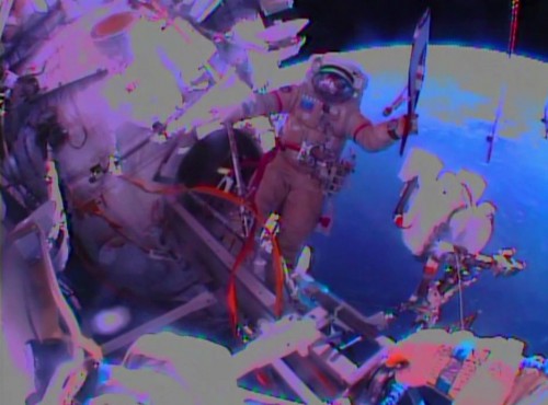 Oleg Kotov proudly displays the red-and-chrome Olympic torch at the beginning of an ultimately disappointing Russian EVA-36 on 9 November 2013. Photo Credit: NASA