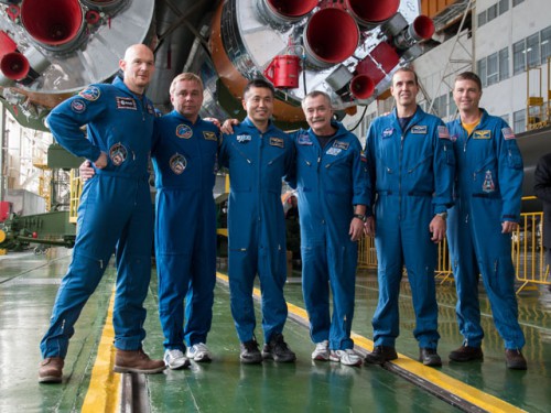 Posing with the many engines of their launch vehicle as a backdrop, the Soyuz TMA-11M prime and backup crews were both ready to support this mission. From left to right are Alexander Gerst, Maksim Surayev, Koichi Wakata, Mikhail Tyurin, Rick Mastracchio and Reid Wiseman. Photo Credit: NASA