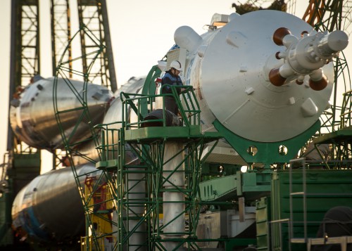 An engineer works on the Soyuz TMA-11M vehicle after its arrival at the launch pad on Tuesday, 5 November. Photo Credit: NASA