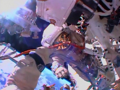 Captured from Oleg Kotov's helmet camera, this view shows Sergei Ryazansky, who made his first career EVA today. Photo Credit: NASA