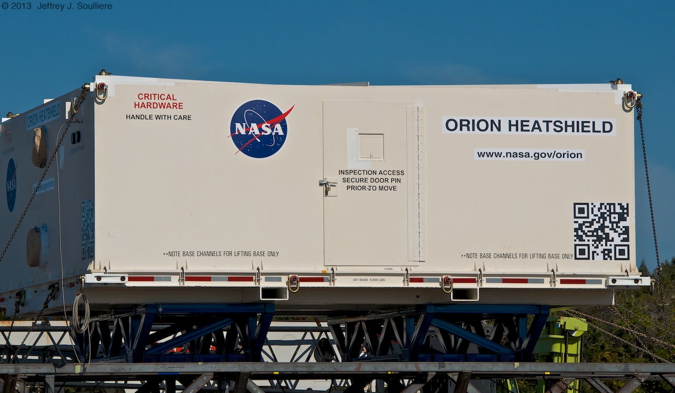 The heat shield for NASA's Orion EFT-1 spacecraft being unloaded at Kennedy Space Center last Thursday.  Photo Credit: AmericaSpace / Jeffrey Soulliere