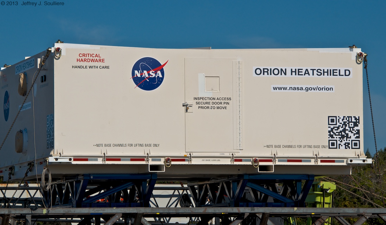The heat shield for NASA's Orion EFT-1 spacecraft being unloaded at Kennedy Space Center last Thursday. Photo Credit: AmericaSpace / Jeffrey Soulliere