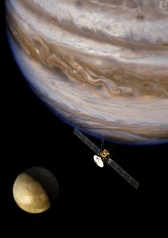 An artist's concept of ESA's JUICE mission during a flyby of Europa. Image Credit: ESA/AOES 
