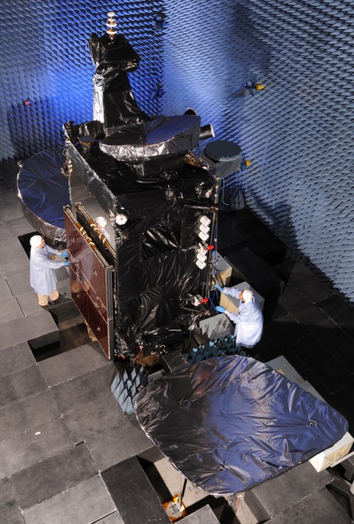 Technicians work on the Thaicom-6 telecommunications satellite at Orbital Science Corporation's Dulles, Virginia facility.  SpaceX is expected to launch the spacecraft atop their new Falcon-9 v1.1 rocket from Florida NET Jan. 3, 2014.  Photo Credit: Orbital Sciences Corporation