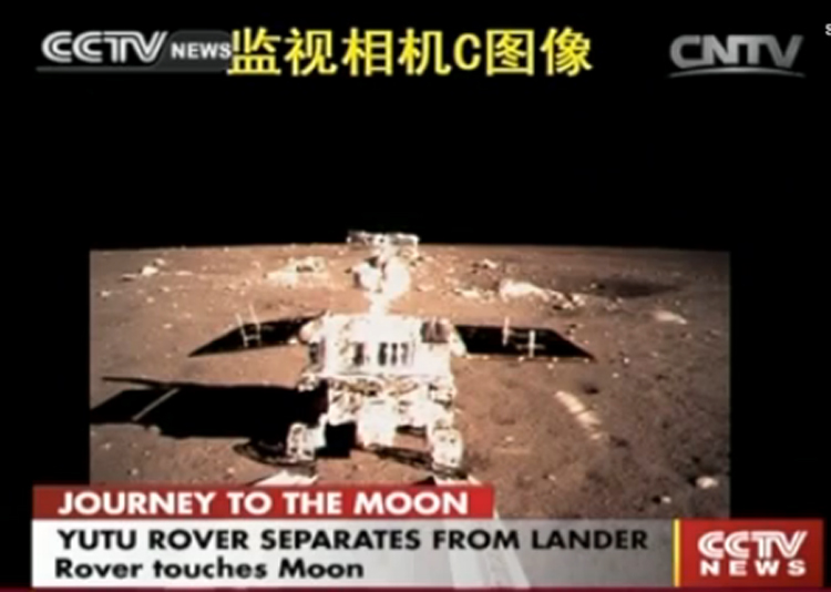 Yutu, aka Jade Rabbit, departs China' Chang'e 3 lander for its first steps on the surface of the moon.  Image Credit: CNSA / CCTV