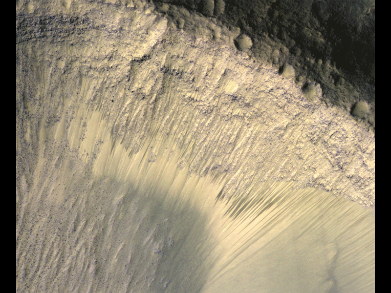 These images from the High Resolution Imaging Science Experiment (HiRISE) camera on NASA's Mars Reconnaissance Orbiter show how the appearance of dark markings on Martian slope changes with the seasons. Image Credit: NASA/JPL-Caltech/Univ. of Arizona
