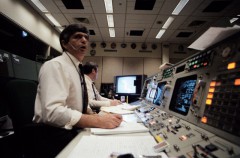 Horror and shock is etched on the faces of Flight Directors Jay Greene (foreground) and Lee Briscoe in the aftermath of the explosion. Photo Credit: NASA