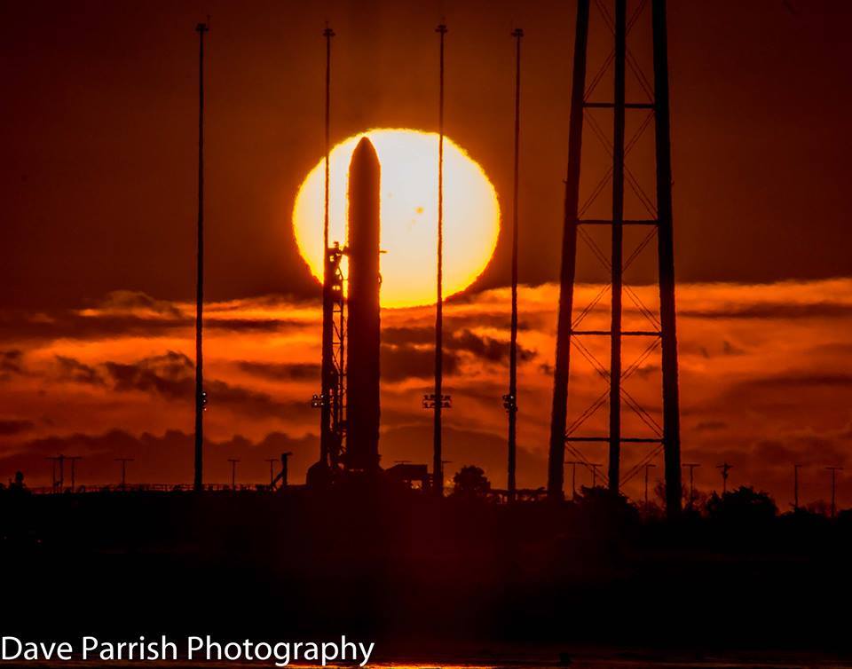 The sun rises behind Antares on Wed., Jan. 8, 2014.  The sunspot which caused a 24-hour delay due to extreme solar radiation is clearly visible.  Photo Credit: AmericaSpace / Dave Parrish