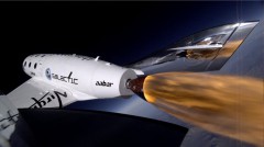 A photograph taken by a camera on one of SpaceShip Two's tail booms, capturing the ignition of the spaceplane's rocket engine, during the Jan. 9 successful flight-test. Virgin Galactic