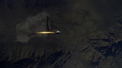 The moment of ignition of SpaceShip Two's rocket engine, as seen from the WhiteKnight Two mothership that had carried it to 46.000 ft of altitude. Image Credit: Virgin Galactic