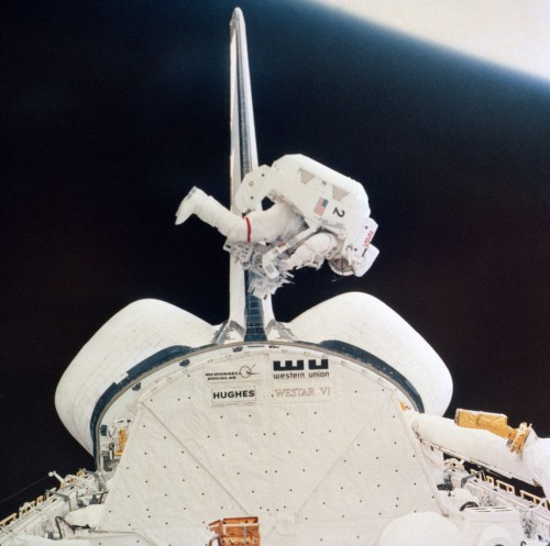McCandless checks out the control systems of the MMU, before departing the vicinity of Challenger's payload bay on 7 February 1984. Photo Credit: NASA