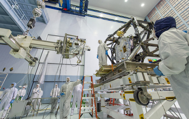 MIRI, the mid-infrared camera and spectrograph (left), was installed in the science payload module of the James Webb Space Telescope (right) on 29 April 2013 at the NASA Goddard Space Flight Center. Photo Credit: NASA Goddard/Chris Gunn