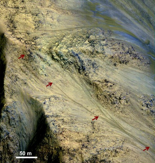 This image includes an especially long example of a type of dark marking that advances down some Martian slopes in warmer months and fades away in cooler months. Image credit: NASA/JPL-Caltech/Univ. of Arizona