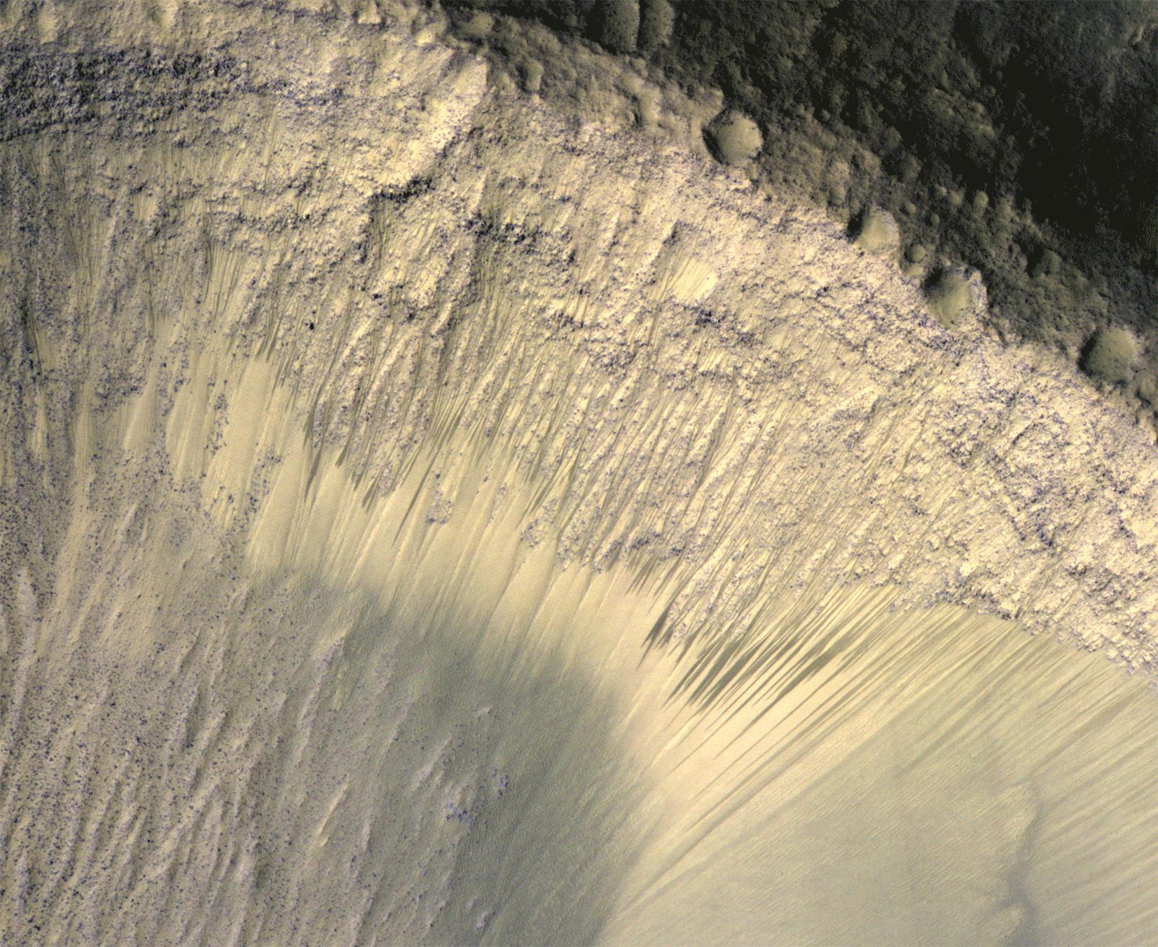 Images from the High Resolution Imaging Science Experiment (HiRISE) camera on NASA's Mars Reconnaissance Orbiter show how the appearance of dark markings, possibly liquid water, on Martian slope changes with the seasons. Photo Credit: NASA/JPL-Caltech/Univ. of Arizona