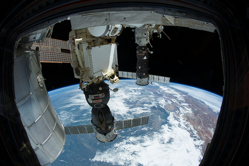 The Progress M-22M spacecraft (far right) is pictured in December 2013, whilst docked at the International Space Station (ISS). The similarity of design between the Progress and the piloted Soyuz TMA-11M spacecraft, at center, is particularly obvious. Photo Credit: NASA