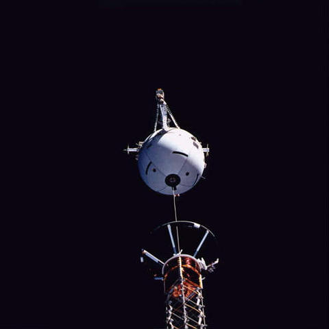 The Tethered Satellite System (TSS) begins its deployment from the payload bay mast on STS-75. Photo Credit: NASA