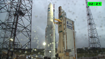 Ariane 5's 72nd mission was almost stalled by rain, ground winds and the risk of lightning. However, an expansive launch window offered Arianespace some breathing space. Photo Credit: Arianespace, with thanks to Mike Barrett