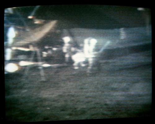 In this televised image, Al Shepard becomes the first person to play golf on another world. Photo Credit: NASA