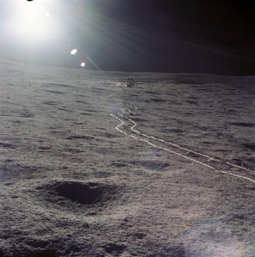 Pictured towards the end of one of their Moonwalks, this view captures the desolation of the Fra Mauro site. Photo Credit: NASA