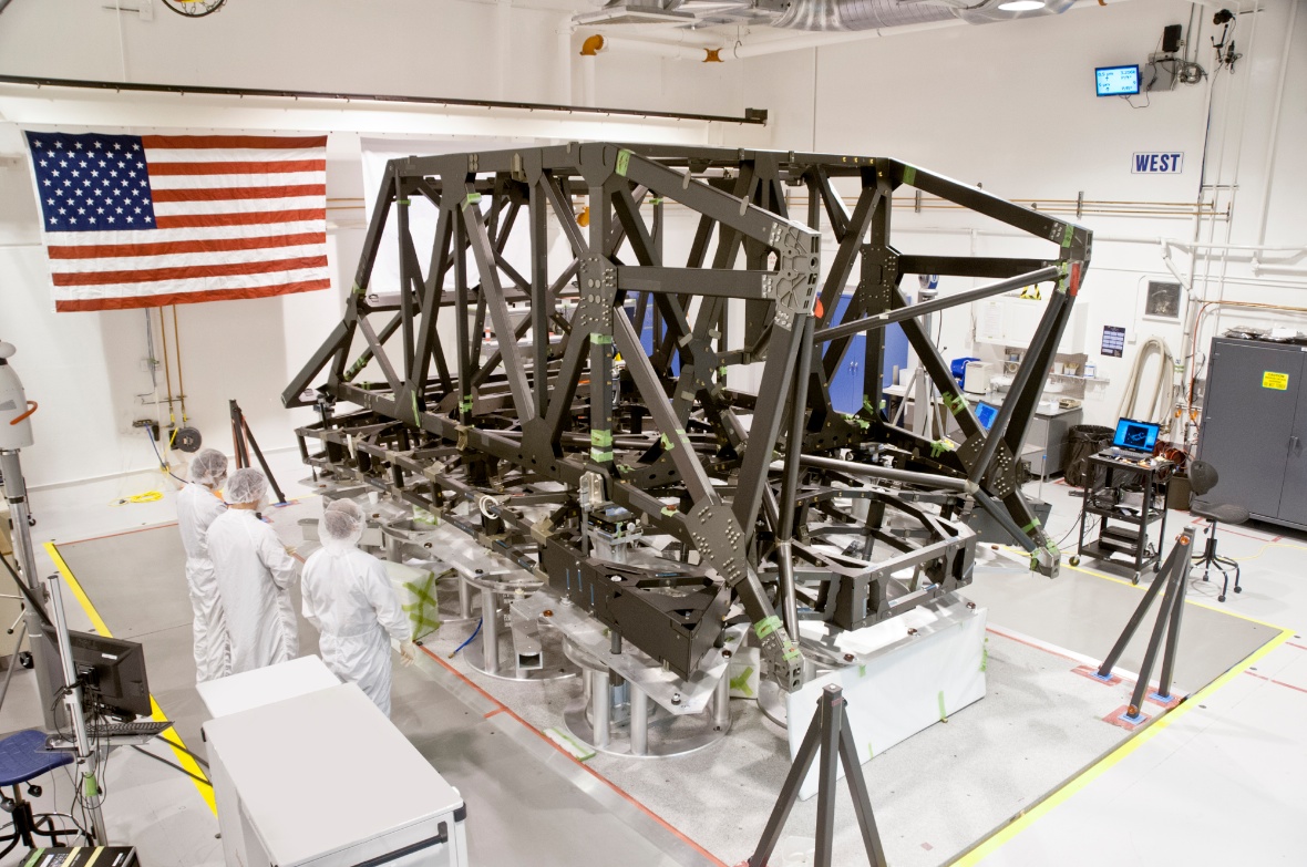 Technicians complete the center section of the backplane and backplane support frame for NASA's James Webb Space Telescope at ATK's facility in Magna, Utah. Image Credit: ATK