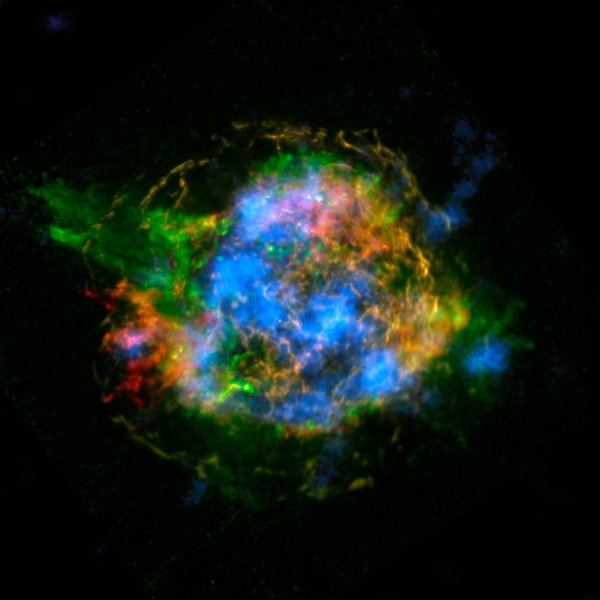 This is the first map of radioactivity in a supernova remnant, the blown-out bits and pieces of a massive star that exploded. The blue color shows radioactive material mapped in high-energy X-rays using NuSTAR. Heated, non-radioactive elements previously imaged by Chandra using low-energy X-rays are shown in red, yellow and green. Image Credit: Image Credit/Caption: NASA/JPL-Caltech/CXC/SAO 