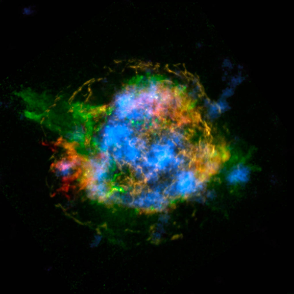 This is the first map of radioactivity in a supernova remnant, the blown-out bits and pieces of a massive star that exploded. The blue color shows radioactive material mapped in high-energy X-rays using NuSTAR. Heated, non-radioactive elements previously imaged by Chandra using low-energy X-rays are shown in red, yellow and green. Image Credit: Image Credit/Caption: NASA/JPL-Caltech/CXC/SAO