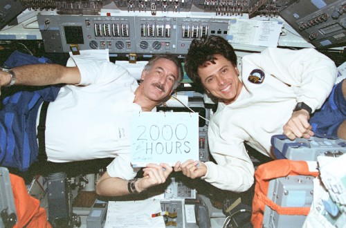 On STS-75, Jeff Hoffman and Franklin Chang-Diaz became the first and second humans to log a cumulative 1,000 hours aboard the Shuttle. They celebrated their achievement with this home-made banner. Photo Credit: NASA