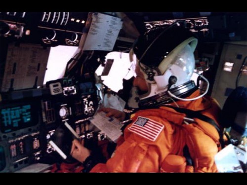Pilot Scott 'Doc' Horowitz is pictured during the re-entry phase of the STS-75 mission in his seat on Columbia's flight deck. Photo Credit: NASA