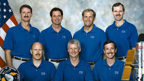 The STS-82 crew included four crew members who had either flown with Hubble previously or trained extensively on EVA tasks associated with the telescope. Seated (left to right) are Ken Bowersox, Steve Hawley and Scott Horowitz, with Joe Tanner, Greg Harbaugh, Mark Lee and Steve Smith standing. Hawley had deployed HST, Bowersox had flown the SM-1, Harbaugh had served as a backup crewman for SM-1 and Lee had worked on EVA development in his role as chief of the astronaut office's EVA Branch. Photo Credit: NASA