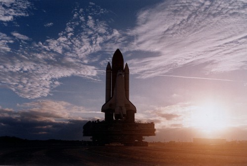 Beautiful view of the STS-82 rollout on 17 January 1997. Cracks in the crawler surface halted the rollout whilst the stack was on the crawlerway, but were not considered hazardous and the rollout proceeded normally. Photo Credit: NASA