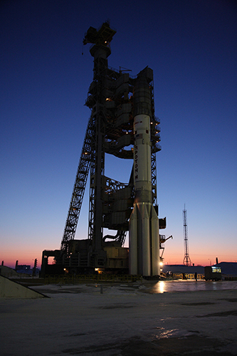The Proton-M and its Türksat 4A primary payload are pictured at the Mobile Service Tower, backdropped by the early glimmers of dawn at Baikonur Cosmodrome. Photo Credit: ILS 