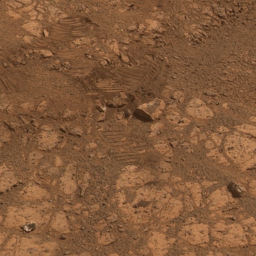 This image from NASA’s Mars Exploration Rover Opportunity shows where a rock called "Pinnacle Island" (lower left corner) had been before it appeared in front of the rover in early January 2014. Image Credit: NASA/JPL-Caltech/Cornell Univ./Arizona State Univ.