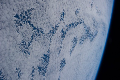 A wonderful photograph of the Earth from orbit, taken from the astronauts aboard the International Space Station, showing a series of clouds with a shape similar to that of snowflakes. Image Credit: NASA