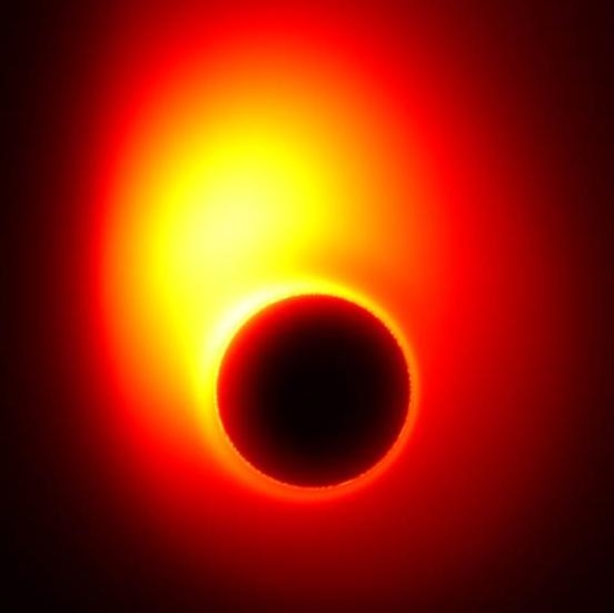 A computer generated image depicting the event horizon around a black hole. The material that is trapped by the black hole's gravity is accreted around the event horizon, creating a 'ring' that astronomers call the event horizon's "shadow". The Event Horizon Telescope aims to image the "shadow" of Sagittarius A*, a supermassive black hole lying at the heart of the Milky Way galaxy, possibly producing images such as this. Image: Avery E. Broderick/Perimeter Institute and University of Waterloo