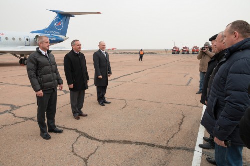 The Soyuz TMA-12M crew (left) is greeted by Russian officials upon arrival at Baikonur on 13 March. Photo Credit: NASA 
