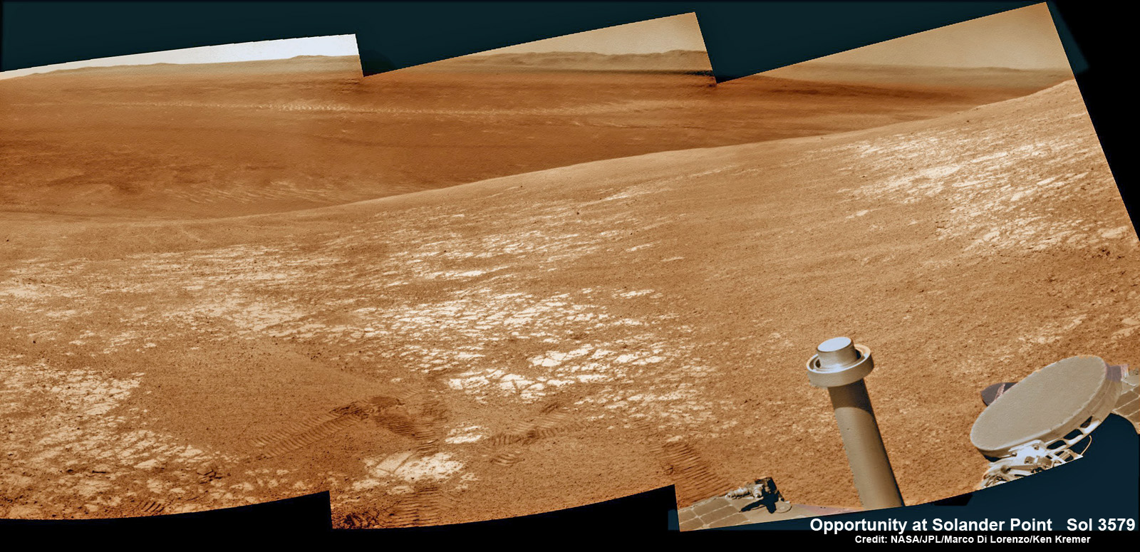 NASA’s Opportunity rover was imaged here from Mars orbit by the MRO HiRISE camera on Feb. 14, 2014. This mosaic shows Opportunity’s view while looking back to vast Endeavour crater from atop Murray Ridge by summit of Solander Point. Opportunity captured this photomosaic view on Feb. 16, 2014 (Sol 3579) from the western rim of Endeavour Crater where she is investigating outcrops of potential clay minerals formed in liquid water. Assembled from Sol 3579 colorized navcam raw images. Credit: NASA/JPL/Cornell/Marco Di Lorenzo/Ken Kremer-kenkremer.com