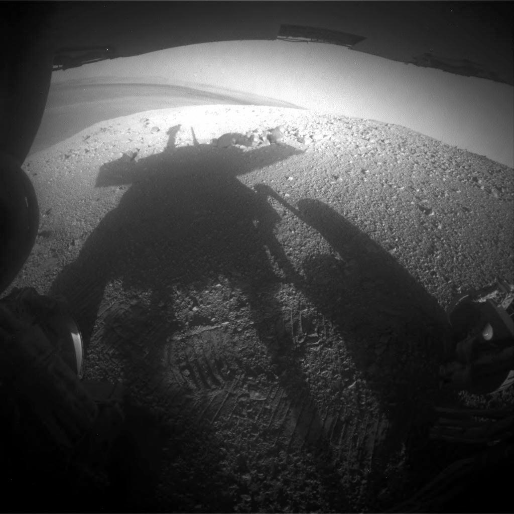 Shadow Portrait of NASA Rover Opportunity on Martian Slope.  NASA's Mars Rover Opportunity caught its own silhouette in this late-afternoon image taken by the rover's rear hazard avoidance camera. This camera is mounted low on the rover and has a wide-angle lens. The image was taken looking eastward shortly before sunset on Sol 3609 (March 20, 2014).  Credit: NASA/JPL-Caltech