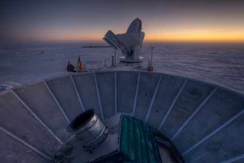 BICEP2 in the foreground and the South Pole Telescope in the background, during sunset at the south pole. Photo Credit: Steffen Richter (Harvard University)